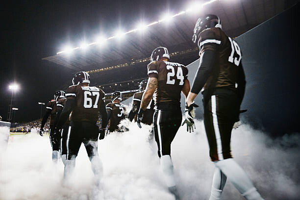 Poster Football team walking out of stadium tunnel