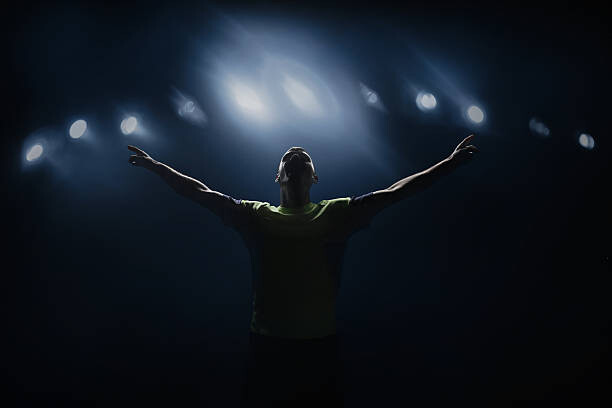 Canvas Print Soccer player shouting in stadium, victorious