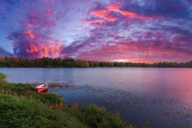 Juliste A rowboat on the beach. Sunset