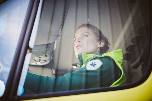 Juliste Thoughtful mid adult paramedic sitting in