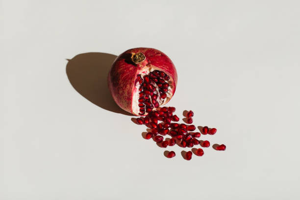 Juliste ut pomegranate on a white background.