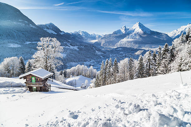 Juliste Winter wonderland with mountain chalet in the Alps