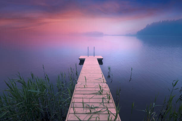 Juliste Wooden pier. Midsummer lake at evening in Finland
