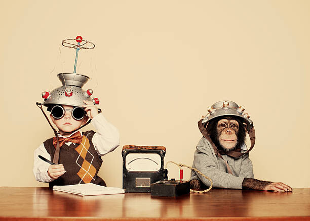 Juliste Young Boy Nerd Reads Chimpanzee Mind