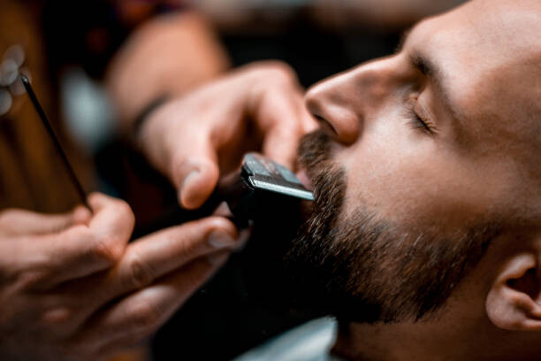Sticker Man getting his mustache shaped by