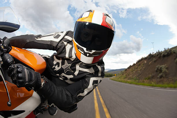 Juliste Motorcycle racer going fast.