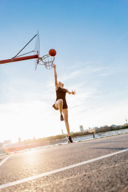 Murais de parede Blonde woman playing basketball in Cologne,