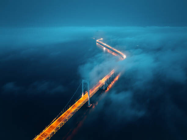 Poster A cross-sea bridge in the fog at night