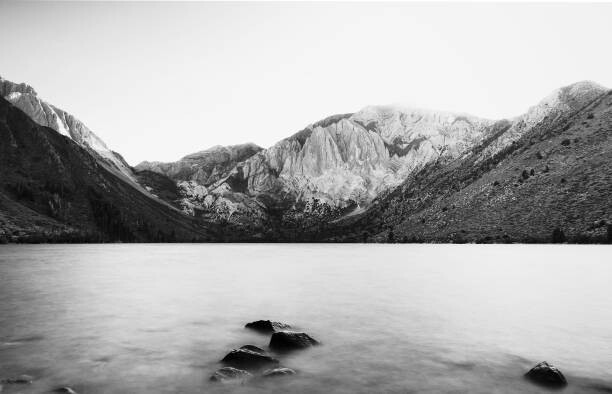 Poster Scenic view of lake and mountains