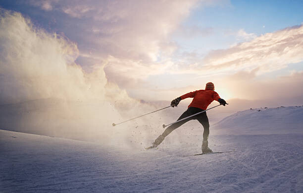 Slika na platnu A cross country skier at sunset in Norway