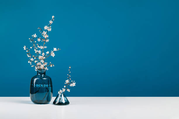Poster Blue glass vases with bouquet of
