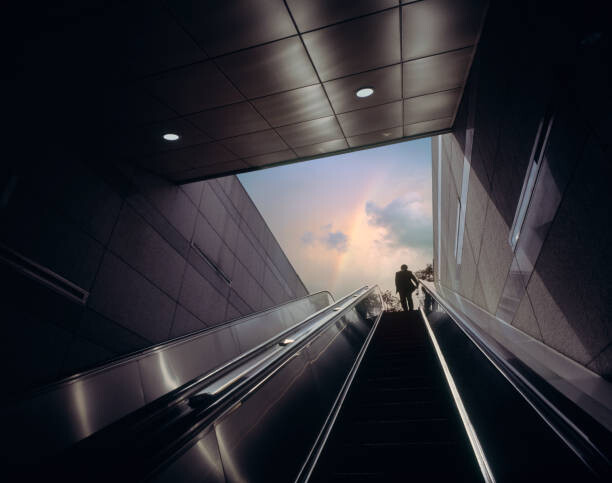Poster Businessman on escalator moving towards sky