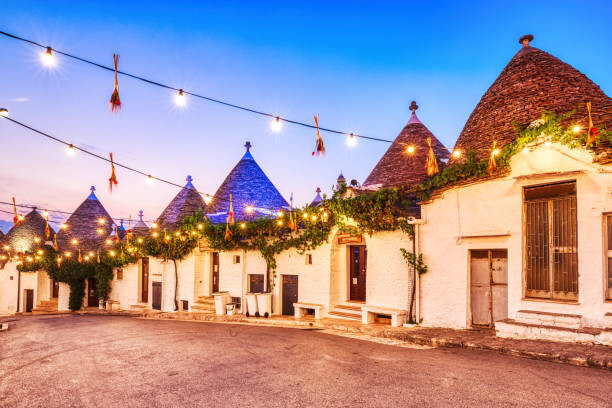 Poster Famous Trulli Houses in Alberobello Illuminated