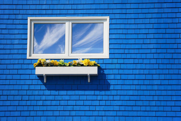 Poster A window on a blue wall.