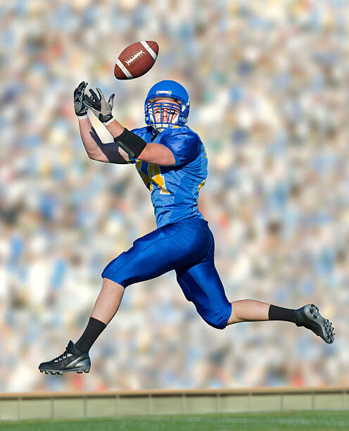 Poster American footballer catching ball