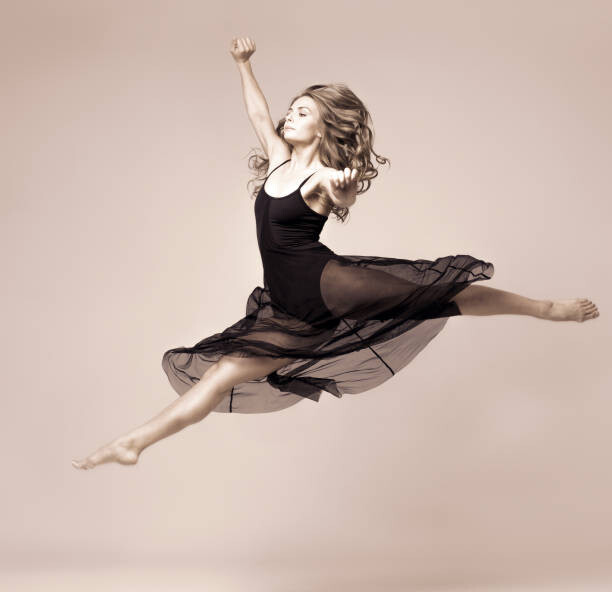 Poster Ballet dancer woman black dress. Studio shot.