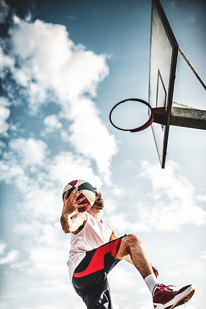 Poster basketball player jumping to score