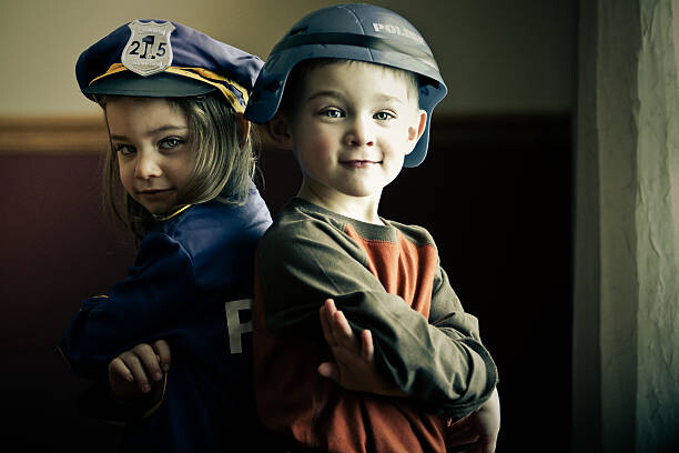 Poster Boy and girl twins dressed up as police officers
