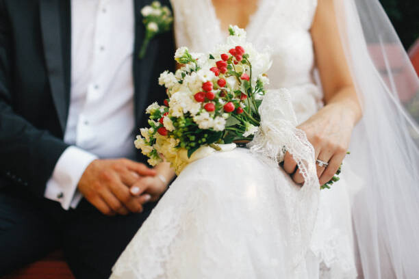 Poster bride and groom holding hands