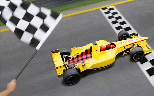 Poster Checkered Flag Waving as Racecar Crosses