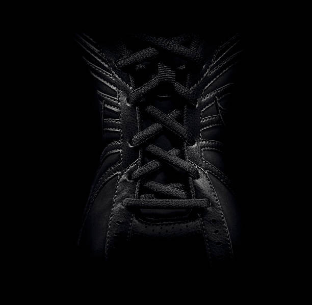 Poster Close up of laced sneaker
