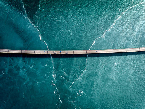 Плакат Driving on a bridge over deep blue water
