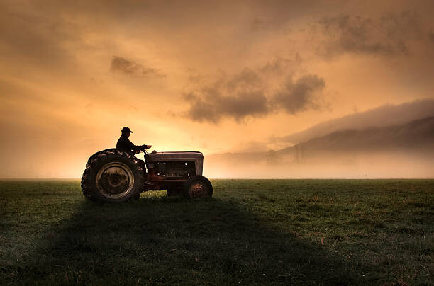 Poster Farmer riding tractor