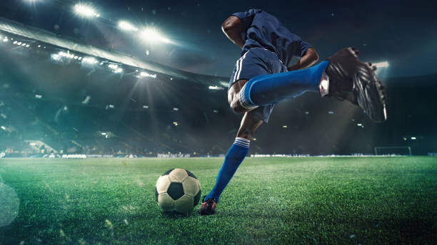 Poster Football or soccer player in action