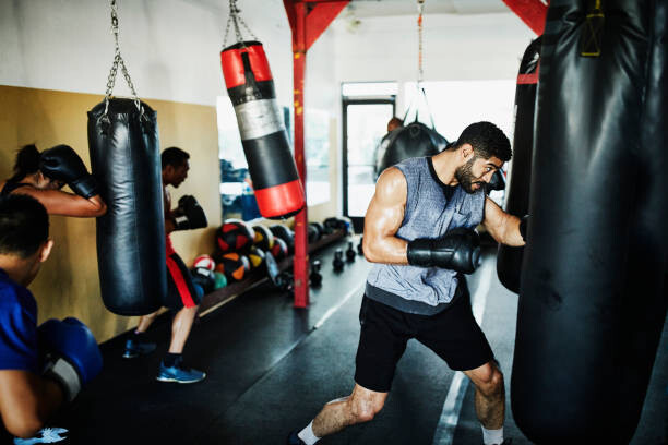 Poster Male and female boxers working out