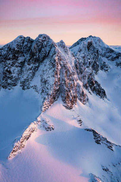 Poster Pink sunrise over snowcapped mountains, Italy