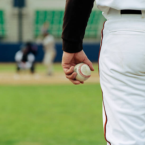 Poster Pitcher on Mound Holding Baseball