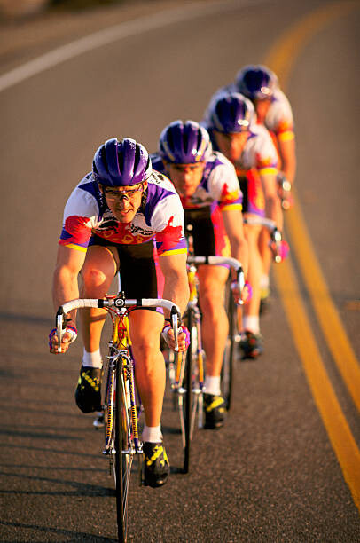 Poster Road racing cyclist team riding in