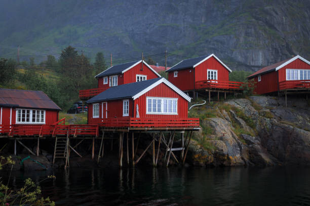 Poster Scenic view of lake by buildings against sky