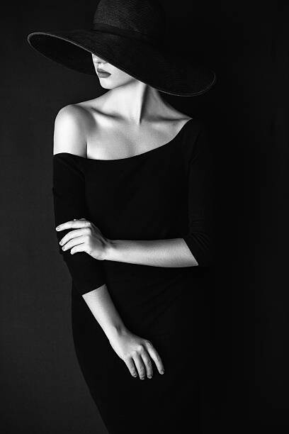 Poster Studio shot of young beautiful woman wearing hat
