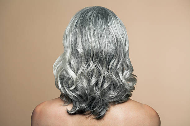 Poster Woman with grey hair, back view.