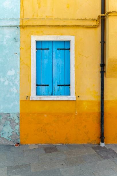 Poster Yellow house with blue window, colorful