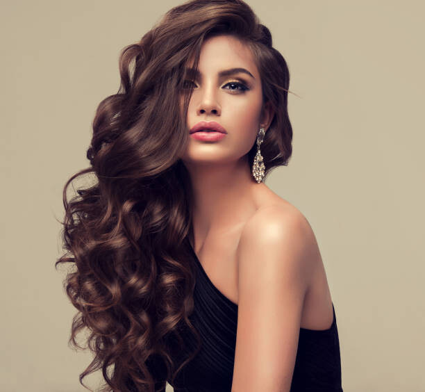 Poster Young attractive brunette with voluminous, shiny