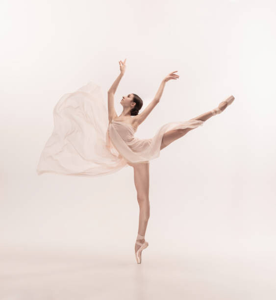 Poster Young graceful tender ballerina on white