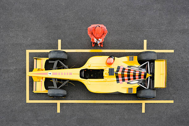Sticker Racecar Driver Standing by Racecar Adjusting