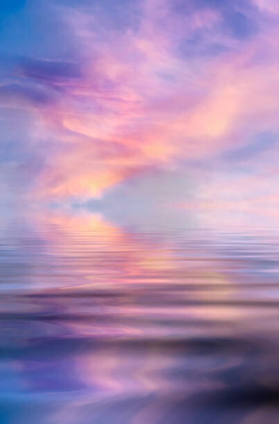 Αυτοκόλλητο Sunset over a water surface with waves.