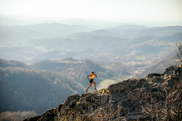 Quadro em tela Woman running on mountain