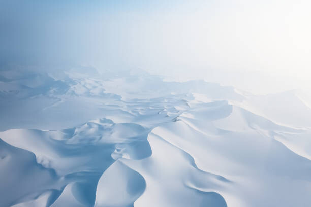 Wall Mural Aerial view of Snow covered desert sand dunes