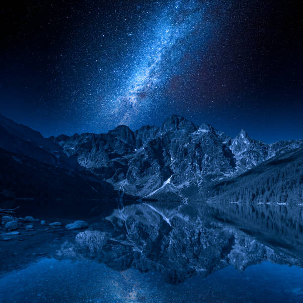 Фототапет Milky way and lake in the