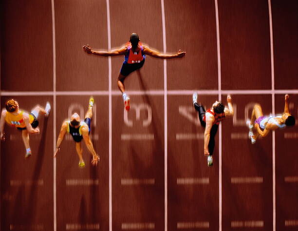 Αφίσα Athletes in race crossing finishing line,