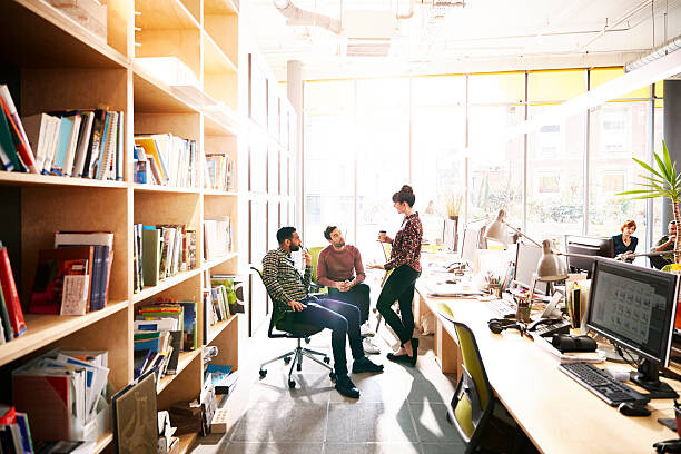 Αφίσα Creative coworkers chatting over ideas in office