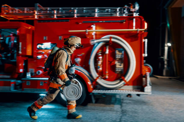 Αφίσα Firefighter running with a hose next