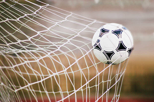Αφίσα Football Trapped in a Goal Net, Close-Up