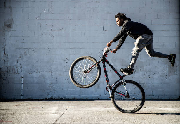 Αφίσα Young male BMX rider performing wheelie