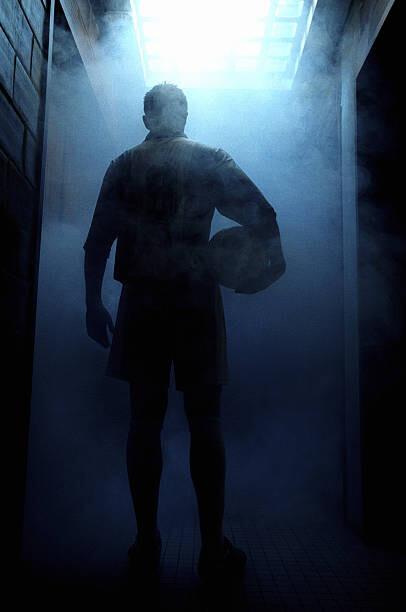Εκτύπωση καμβά Football player entering steam room, rear view