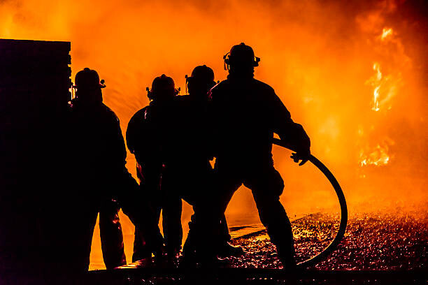 Картината върху платно Firefighters silhouette